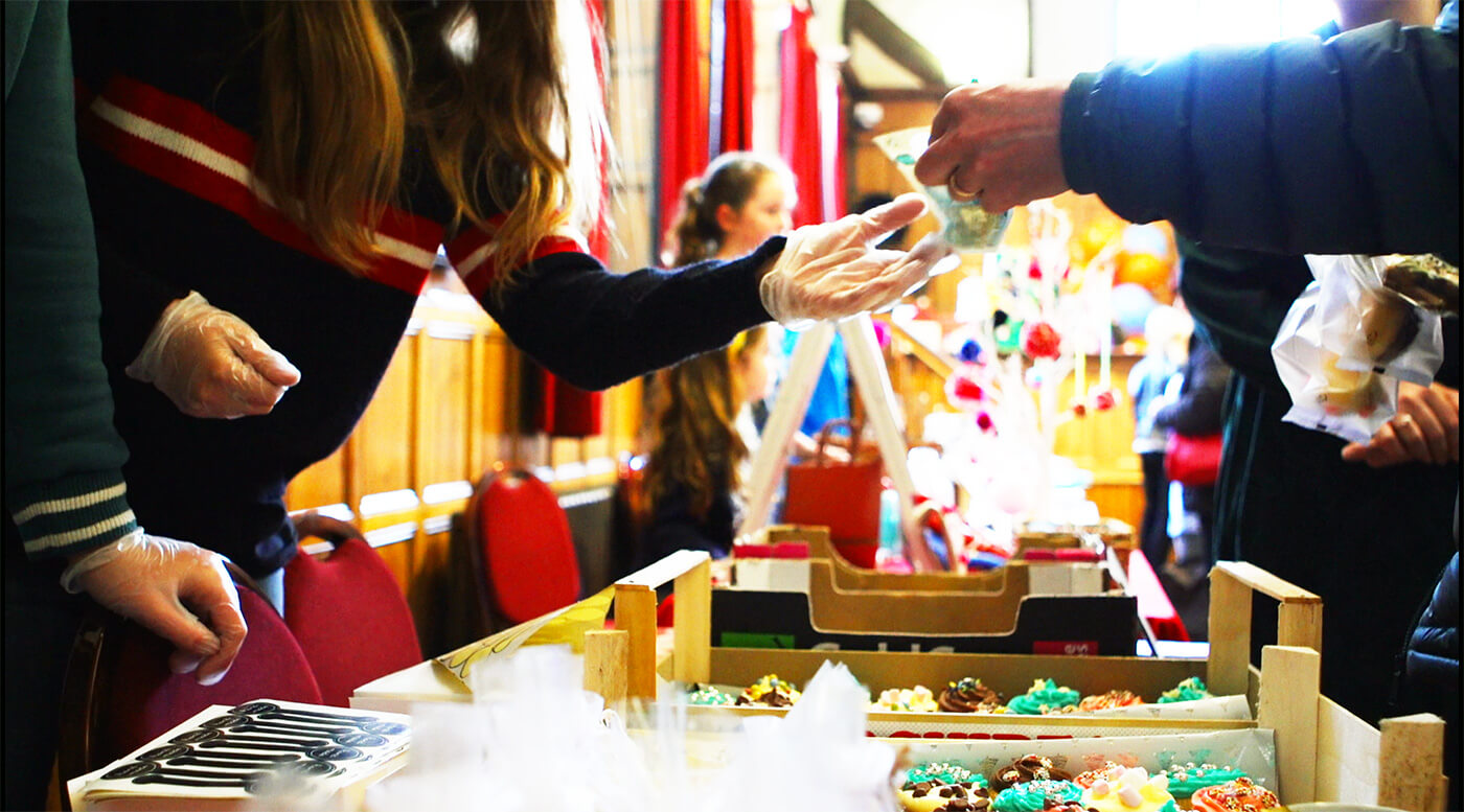 gentleman buying something at fair
