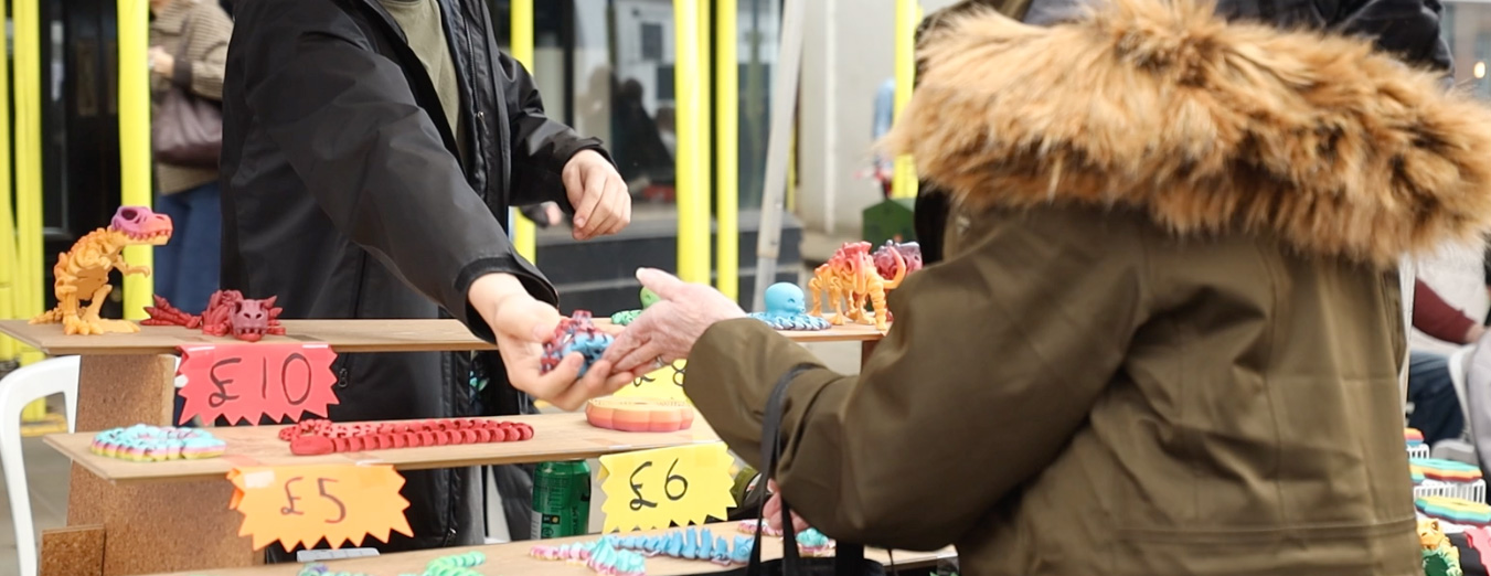Young entrepeneur makes a sale at the Young Business Showcase