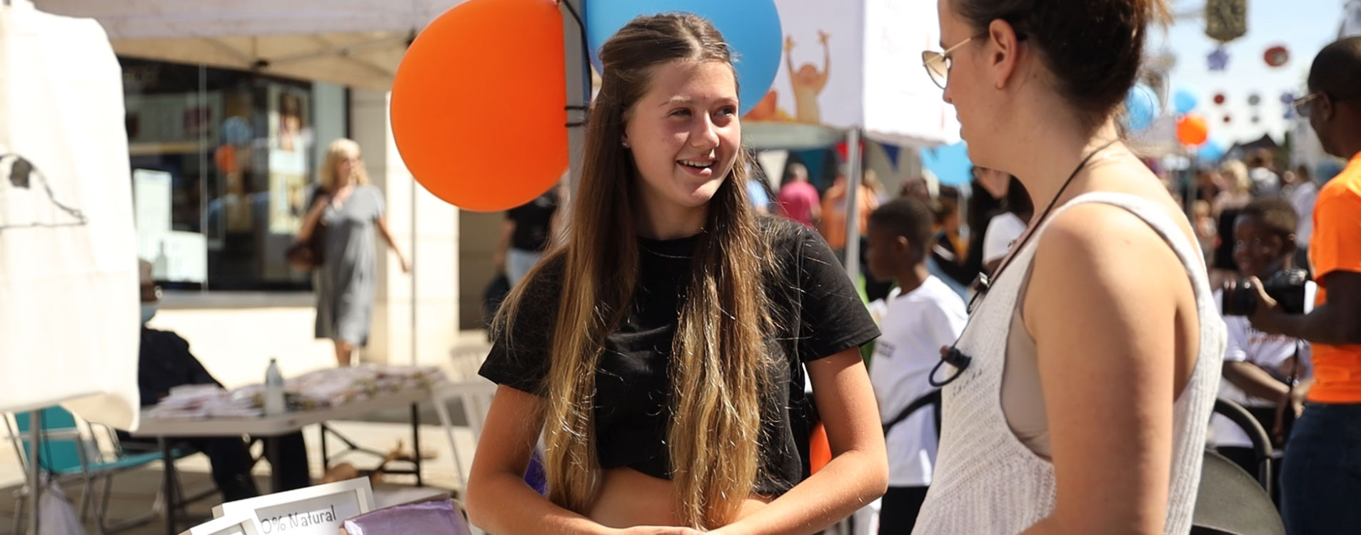 Young-entrepreneur-talks-to-a-customer at the Young Business Showcase