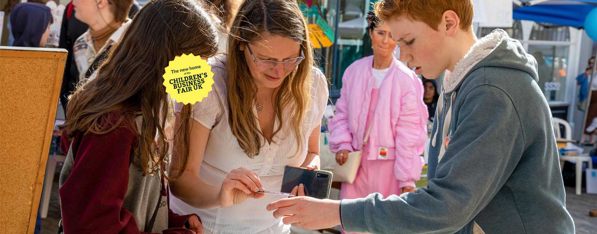 Young-entrepreneur-takes-payment-at-the-Young-Business-Showcase_Badge